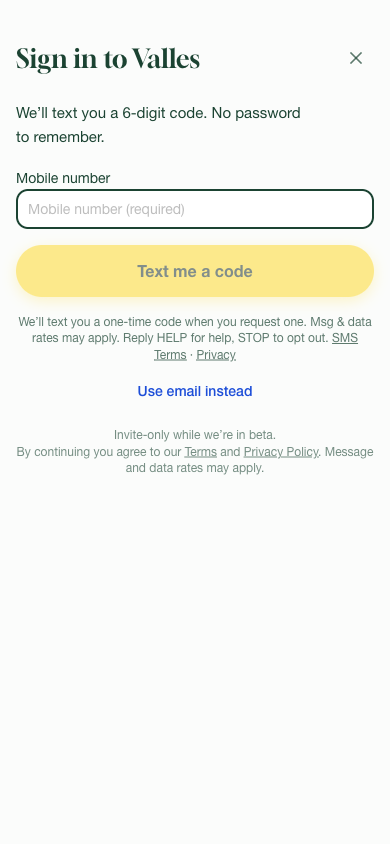 The Valles sign-in screen: a mobile number field, a “Text me a code” button, and the SMS consent notice beneath it.